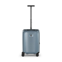 Load image into Gallery viewer, Front panel view in Light blue. It has horizontal ridges, the Victorinox logo on the front, a black and gray telescopic handle extended, and four black wheels.