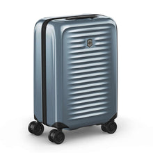 Load image into Gallery viewer, Angled front view of the light blue suitcase with the telescopic handle retracted.