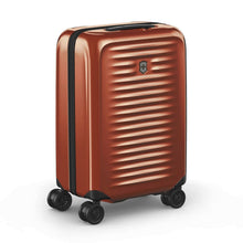 Load image into Gallery viewer, Angled front panel view of the orange suitcase with black accents.