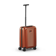 Load image into Gallery viewer, Front angled view of the orange suitcase with the telescopic handle extended.