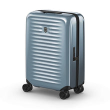 Load image into Gallery viewer, Angled front view of the light blue suitcase with the telescopic handle retracted.