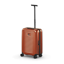 Load image into Gallery viewer, Angled front view of the orange suitcase with the telescopic handle extended.