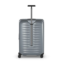 Load image into Gallery viewer, Back panel view of the gray hard shell suitcase with the telescopic handle extended.