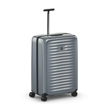 Load image into Gallery viewer, Angled front view of the gray hard shell suitcase. The telescopic handle is extended.