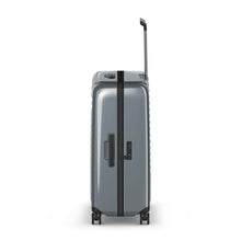 Load image into Gallery viewer, Side panel view of the gray hard shell suitcase, featuring a grab handle and a TSA-approved three-digit combination lock.
