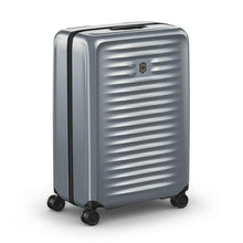 Load image into Gallery viewer, Angled front view of the gray hard side suitcase. The telescopic handle is retracted.