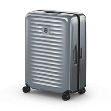 Load image into Gallery viewer, Angled front view of the gray hard side suitcase. The telescopic handle is retracted.