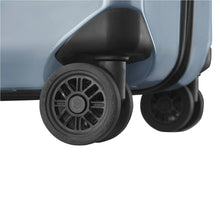 Load image into Gallery viewer, Close up to a wheel on the light blue suitcase.