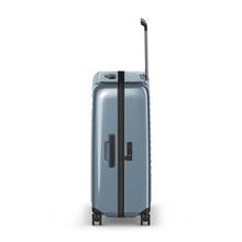 Load image into Gallery viewer, Side panel view of the light blue suitcase, featuring a grab handle and a TSA approved three-digit combination lock.