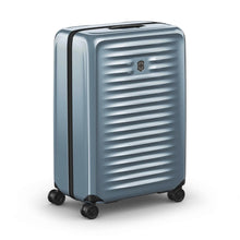 Load image into Gallery viewer, Angled front view of the light blue suitcase with the telescopic handle retracted.