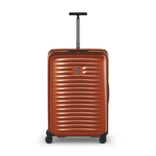 Load image into Gallery viewer, Front panel view of the orange suitcase with the telescopic handle extended.