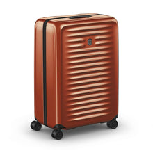 Load image into Gallery viewer, Angled front view of the orange suitcase with the telescopic handle retracted.