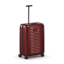 Load image into Gallery viewer, Front angled view of the suitcase with the telescopic handle extended.