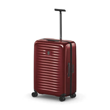 Load image into Gallery viewer, Front angled view of the suitcase with the telescopic handle extended.