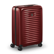 Load image into Gallery viewer, Angled front view of the suitcase with the handle retracted.