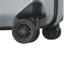 Load image into Gallery viewer, Close up to the silver hard side case's wheels.