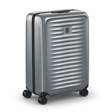Load image into Gallery viewer, Angled front panel view of the silver hard side suitcase with the telescopic handle extended.