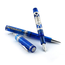 Load image into Gallery viewer, The fountain pen with the cap set to the side resting on the ballpoint pen. Both are laid on a white background.