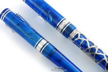 Load image into Gallery viewer, Close up to the cap rings on both pens. They are both engraved with the word "VISCONTI"