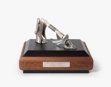 Load image into Gallery viewer, The Fountain Pen set on its display. The presentation box has two small statues, one of an angel with its back to a devil. Their wings form the stand for the pen.