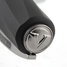 Load image into Gallery viewer, Visconti Divina in Black Matte Pen Series, Cap Close-Up to the medal at the top of the cap with the Visconti logo engraving.