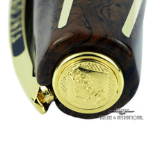 Load image into Gallery viewer, Close up to the top of the cap. it has a medal with the Visconti logo engraved.