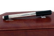 Load image into Gallery viewer, Back view of the fountain pen with the cap, closed. Set on top of the brown leather presentation box.