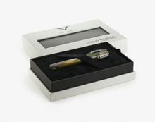 Load image into Gallery viewer, Visconti Homo Sapiens Lotus Garden Limited Edition Pen in the presentation box under the felt strap.