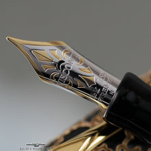 Load image into Gallery viewer, Close up to the nib. It is bi-colored in yellow and white gold, and has decorations engraved.