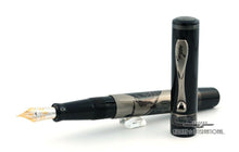 Load image into Gallery viewer, The fountain pen with the cap set in front of it. The clip appears to have some discoloration.