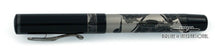 Load image into Gallery viewer, Side view of the fountain pen with the cap on, closed.