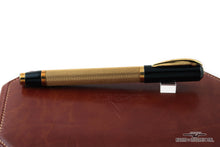Load image into Gallery viewer, Side view of the fountain pen. Set on top of the leather presentation box.
