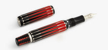 Load image into Gallery viewer, Angled view of the Visconti Backgammon Fountain Pen with the cap set to the side. Laid on a white background.