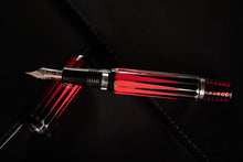 Load image into Gallery viewer, Top view of the Visconti Backgammon Fountain Pen with the grip resting on top of the cap.