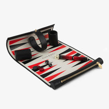Load image into Gallery viewer, Angled view of the pen case unrolled. it features a backgammon board which can be rolled, the pen, some chips and dice.