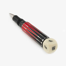 Load image into Gallery viewer, Angled view of the Visconti Backgammon Rollerball Pen. The die placed at the bottom of the pen has the limited edition number. (The one you receive will vary)