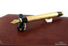 Load image into Gallery viewer, The Fountain pen barrel leaning on the cap. Place don top of the presentation box's leather lid.