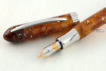Load image into Gallery viewer, Close up to the fountain pen nib with the cap set to the side.