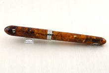 Load image into Gallery viewer, Back view of the fountain pen with the cap on, closed. The cap ring has an engraving that reads 006/100