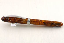 Load image into Gallery viewer, Side view of the fountain pen with the cap on, closed. The cap ring has an engraving that reads VISCONTI.