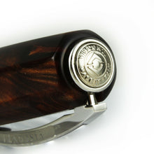 Load image into Gallery viewer, Close up to the top of the cap. It has a medal with the Visconti logo engraved along the text VISCONTI MADE IN ITALY.