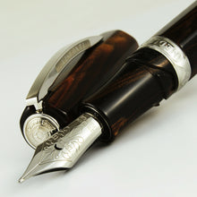 Load image into Gallery viewer, Close up to the fountain pen nib and cap on a white background.