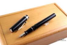 Load image into Gallery viewer, The Fountain Pen with the cap set to the side.