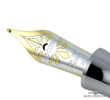 Load image into Gallery viewer, Close up to the fountain pen nib. it is two-toned with engraved decorations and the text: VISCONTI, 18K 750, FIRENZE, M