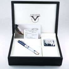 Load image into Gallery viewer, The Fountain pen in the presentation box with its contents: the ink pot in its compartment, a small booklet, and a certificate.