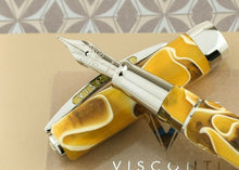 Load image into Gallery viewer, Close up to the Fountain pen resting on the cap.