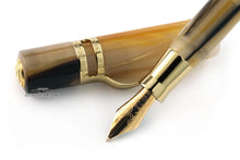 Load image into Gallery viewer, Close up to the fountain pen nib with the cap set behind it. The nib features an engraving with decorations and the text: VISCONTI 20 ANNIVERSARY, 1983-2003, 14kt, 585, FIRENZE, M