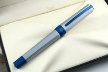 Load image into Gallery viewer, Front view of the fountain pen with the cap on, closed. it has an engraving on the ring that reads "SPEED BOAT"