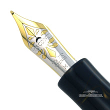 Load image into Gallery viewer, Close up to the fountain pen nib. It is two-toned in white and yellow, made of 18k gold, and engraved with decorations.