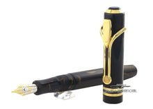 Load image into Gallery viewer, The fountain pen with the cap set in front of it.